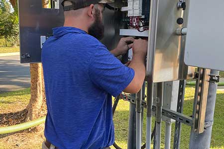 septic system maintenance checking wiring Herring Septic doing septic system maintenance - checking wiring